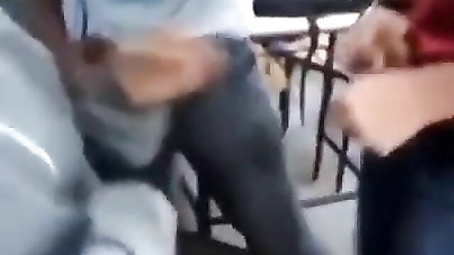 Schoolgirl caught giving two male students blow job in the classroom - 1 image