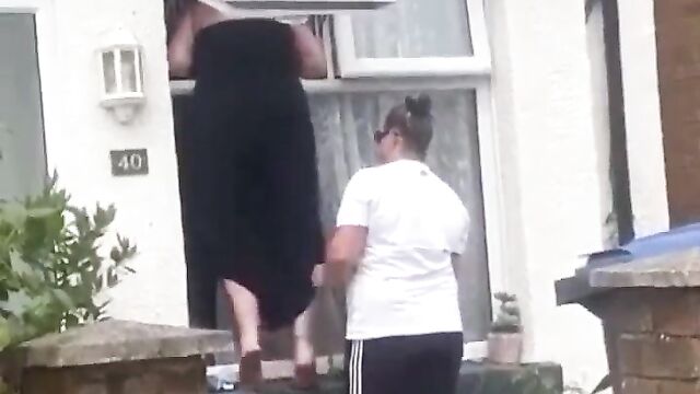 Boobs Out In Public As Woman Falls Upside Down While Trying To Enter An Apartment Through The Window - 3 image