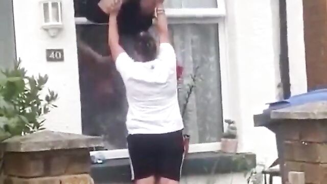 Boobs Out In Public As Woman Falls Upside Down While Trying To Enter An Apartment Through The Window - 4 image
