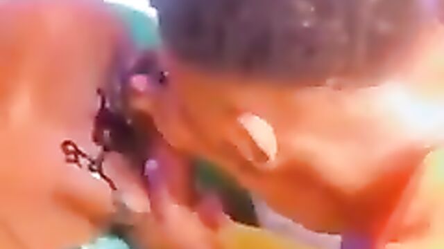 Nigerian Prostitute getting Breast Tattoo - 1 image