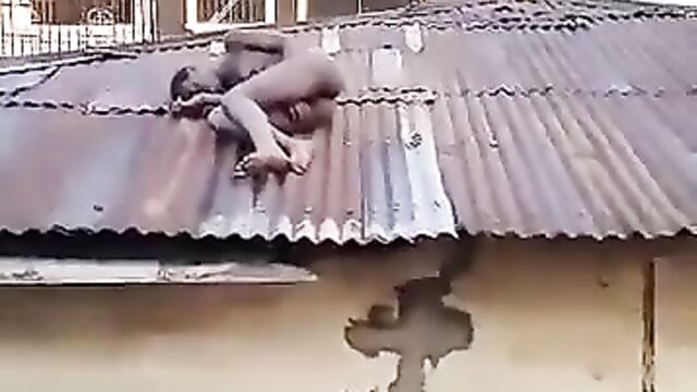 Naked Woman With Small Boobs Caught On Rooftop In Public In Benin City, Nigeria - 1 image