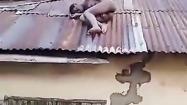Naked Woman With Small Boobs Caught On Rooftop In Public In Benin City, Nigeria