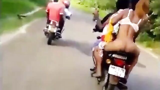 African Prostitute On A Bike Without Panties, Displaying Her Naked Ass And Pussy In Public! - 1 image