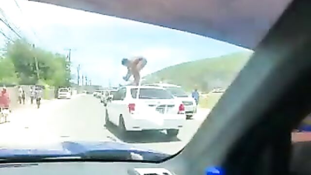 Naked Mad African Woman With Fine Boobs And Ass Standing On A Car In Public And Obstructing Traffic - 4 image
