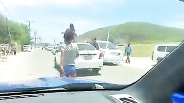 Naked Mad African Woman With Fine Boobs And Ass Standing On A Car In Public And Obstructing Traffic - 5 image