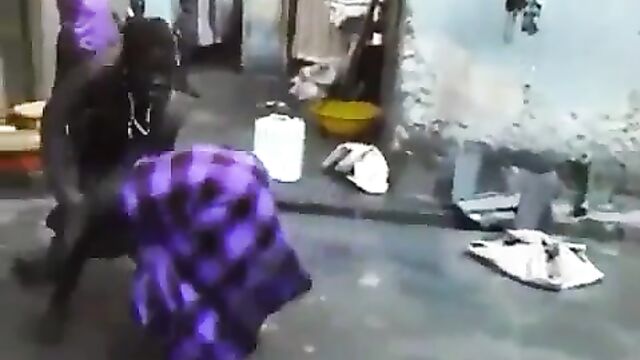 Boobs and ass exposed as African housewife beats and strips her neighbor naked in public for having sex with her husband