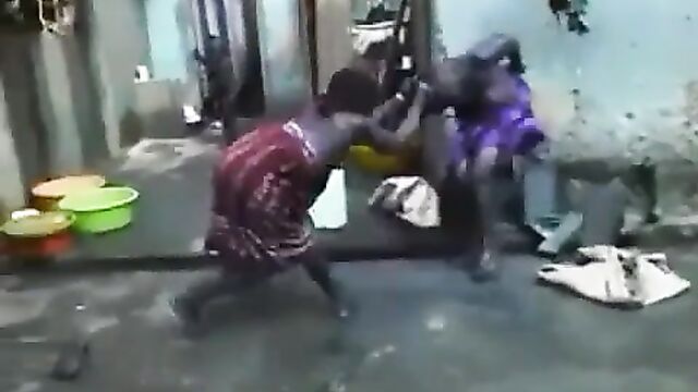 Boobs and ass exposed as African housewife beats and strips her neighbor naked in public for having sex with her husband - 3 image