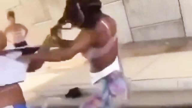 Big breasts fly out in public as 2 black girls fight over white boyfriend - 1 image