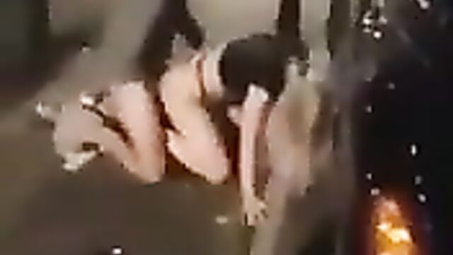 Drunk couple caught having sex on the sidewalk in public - 1 image