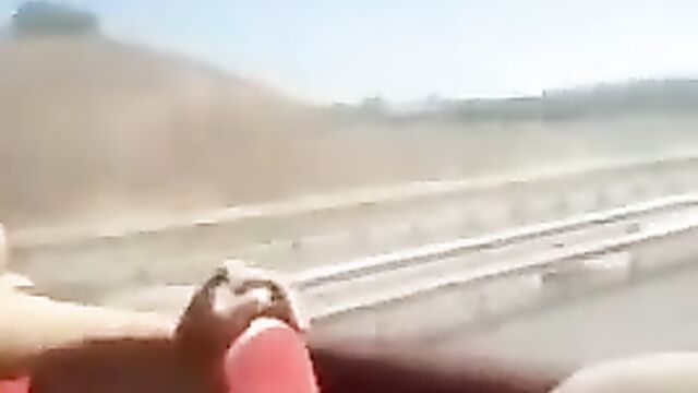 Girls flashing their breasts at the back of a bus in public - 1 image