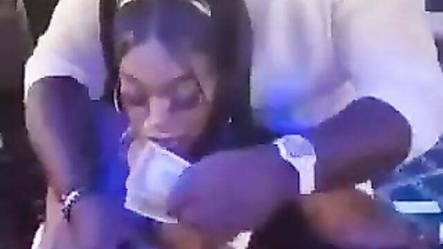 Guy playing with a stripper’s nipples in public in the club