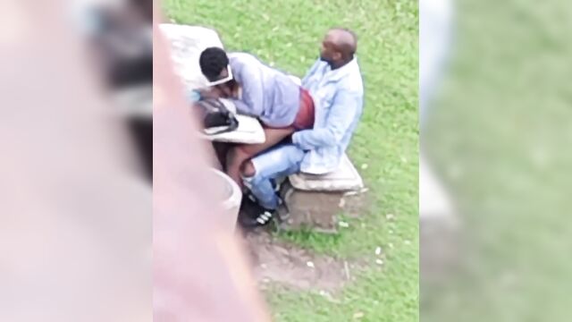 Ebony couple banging in a public park