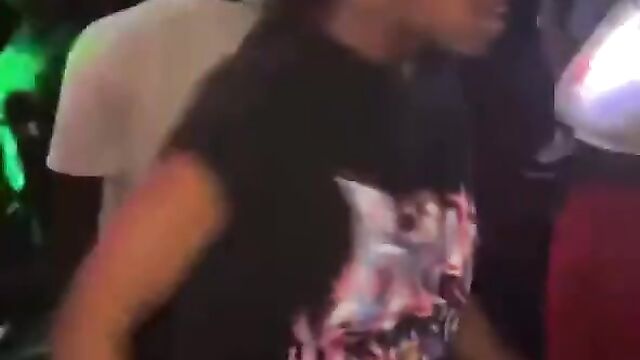 Breasts pop out in public as lady beats up her opponent in the club - 1 image