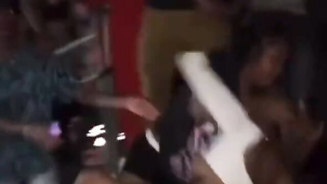 Breasts pop out in public as lady beats up her opponent in the club - 3 image