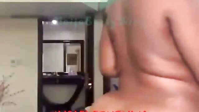 Naked Nigerian girl showing her big breasts and ass to a white man