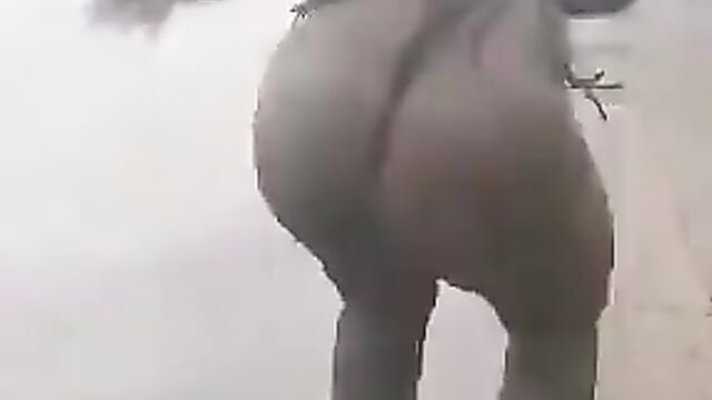 Mad woman stripping herself naked on the street - 3 image