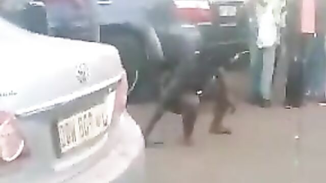 Mad woman stripping herself naked on the street - 5 image