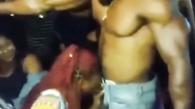 Girl giving a male Stripper head at a party - 1 image