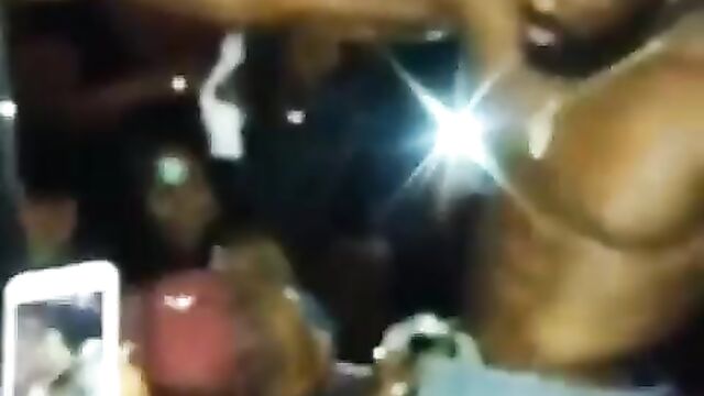 Girl giving a male Stripper head at a party