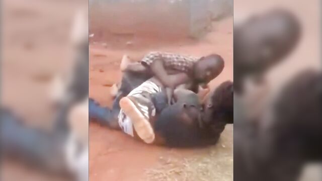 Angry wife beats husband in street fight - 3 image