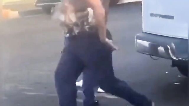 Big breasts pop out in public as couple fight dirty on the street - 1 image