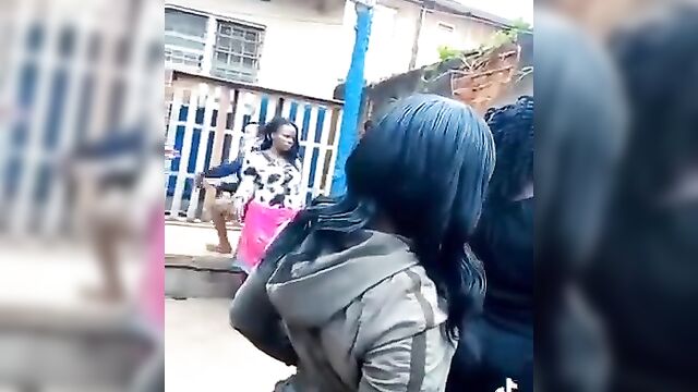 Ass exposed in public as wife fights street whore for snatching her husband - 5 image