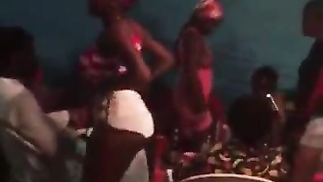 Nigerian runs girls strippers showing boobs and ass in public at a party - 1 image