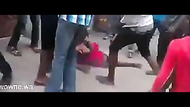 Busty Nigerian woman stripped naked and beaten in public after being allegedly falsely accused of witchcraft and killing her children - 1 image