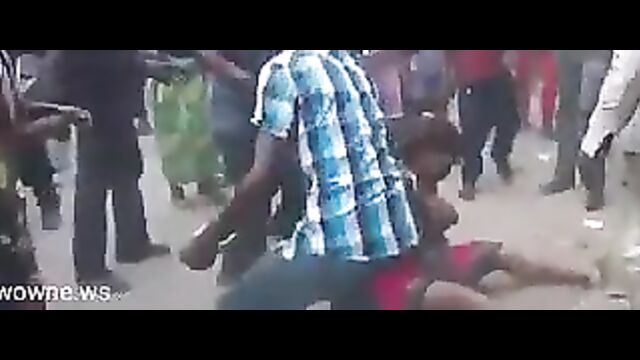 Busty Nigerian woman stripped naked and beaten in public after being allegedly falsely accused of witchcraft and killing her children - 3 image