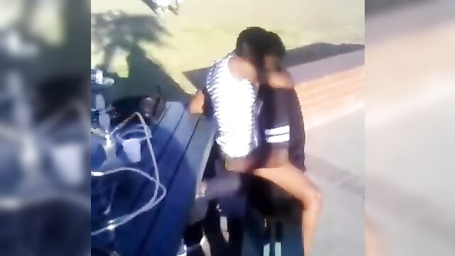 Ebony couple caught having sex on a chair in public - 2 image