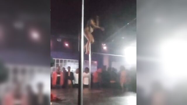 Naked ebony stripper & pole dancer entertaining guests at an nightclub - 1 image