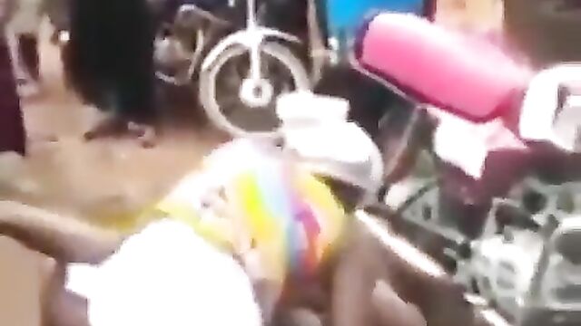 Angry wife beats and strips sidechick naked in the market for sleeping with her cheating husband