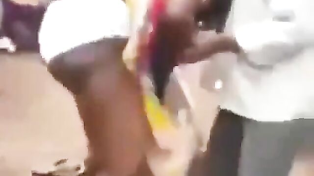 Angry wife beats and strips sidechick naked in the market for sleeping with her cheating husband - 4 image
