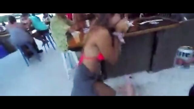 Lady allows man to suck her breast in public