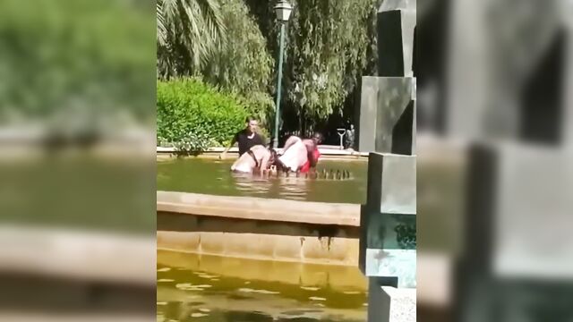 Crazy half naked dude caught fighting wife in a pool and beaten - 3 image