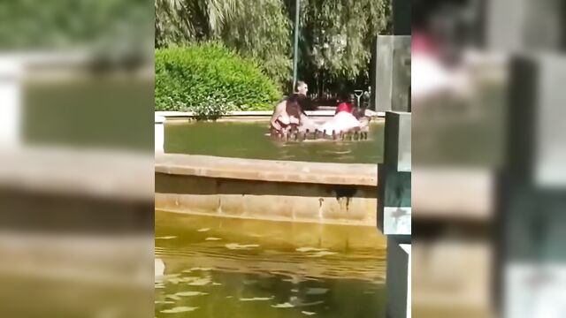 Crazy half naked dude caught fighting wife in a pool and beaten - 4 image