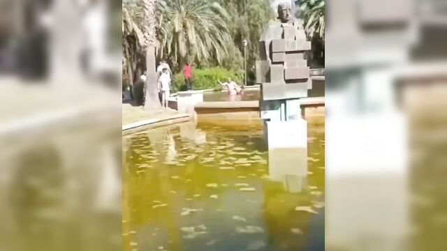 Crazy half naked dude caught fighting wife in a pool and beaten - 5 image