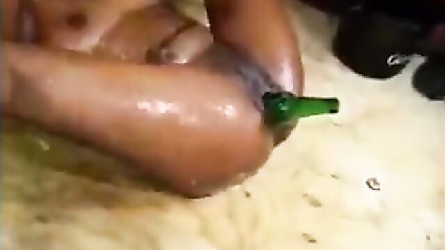 Thot goes Naked & Wild in public with beer bottles in her Pussy at an African club party - 3 image