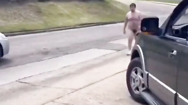 Naked man tries to get into a dude’s truck and gets beaten - 1 image