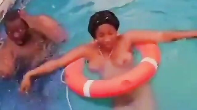 Boobs Out As Nigerian Couple Get Caught Swimming Naked In A Pool In Public