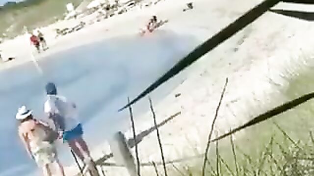 Crazy Couple Having Sex On The Beach In Front Of Passersby In Public - 1 image