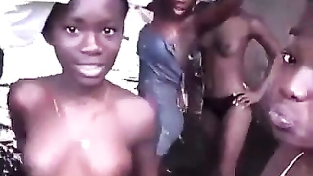 African girls showing their naked breasts in a public stream - 1 image