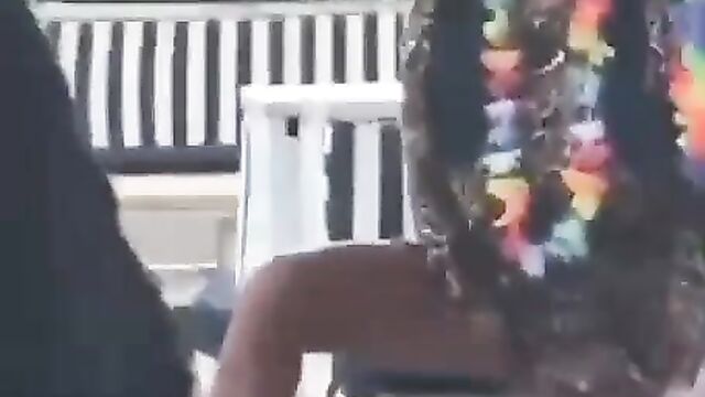 Crazy chick masturbating in a public outdoor location and asked to leave! - 1 image