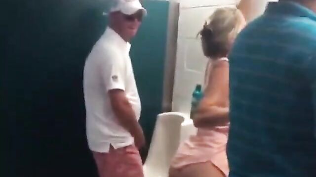 Drunk Miami Dolphins Female Fan With Big Ass Caught Using Men's Toilet