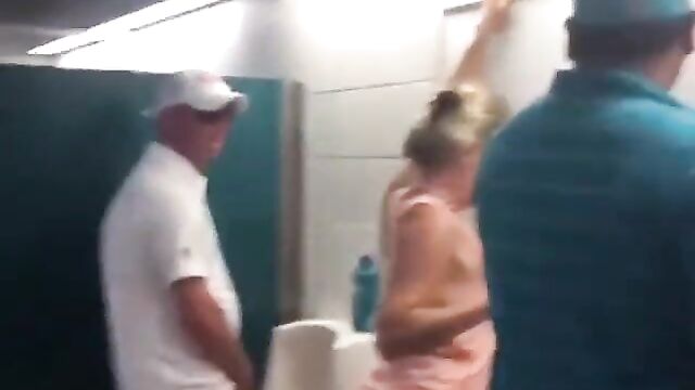 Drunk Miami Dolphins Female Fan With Big Ass Caught Using Men's Toilet - 3 image
