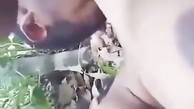 Pussy Exposed As Farmer Gets Caught Having Sex With Local Girl In The Bush And Sucking Her Breasts In Public - 1 image