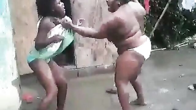 Boobs Out In Public As Half Naked African Woman With Big Breasts And Panties Beats Her Daughter Over Boyfriend - 1 image
