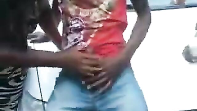 Barbadian Thot Playing With Man’s Dick And Giving Blow Job On Car Bonnet In Public In Broad Daylight - 1 image