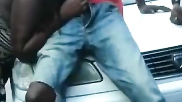 Barbadian Thot Playing With Man’s Dick And Giving Blow Job On Car Bonnet In Public In Broad Daylight - 4 image