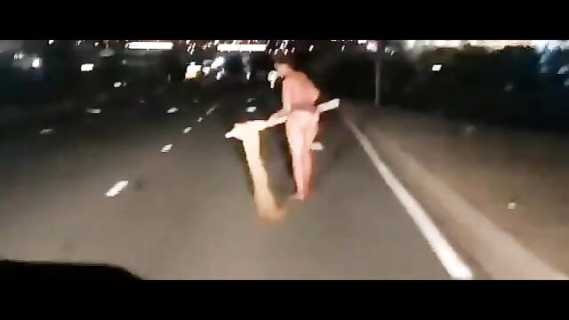 Another Naked Mad African Woman With Big Ass Caught In Public In South Africa, Obstructing Night Traffic